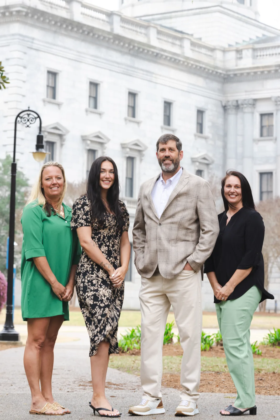 The Keisler Insurance Group team, including owner Jon Keisler, in front of the South Carolina State House in Columbia